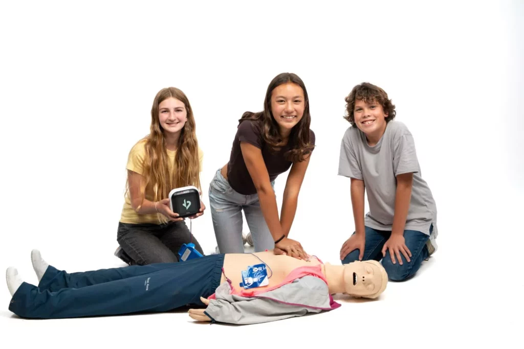 kids performing CPR