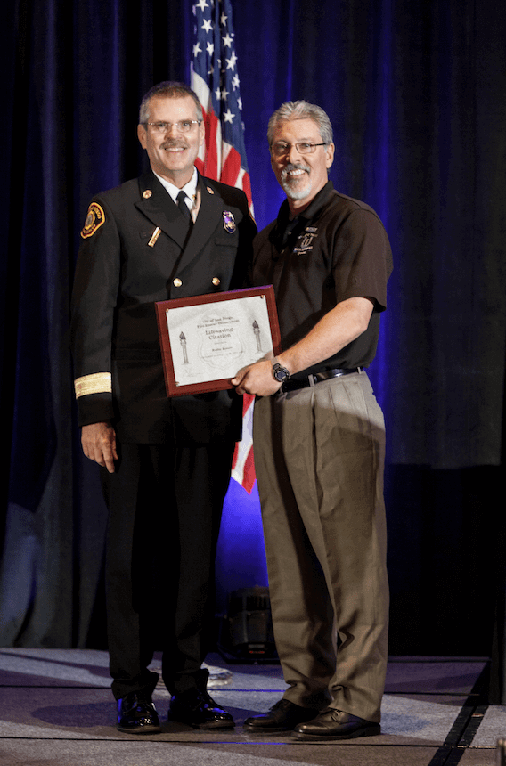Mr. Robbie Bowers Receiving His LifeSaver Citation from the San Diego Fire and Rescue Chief