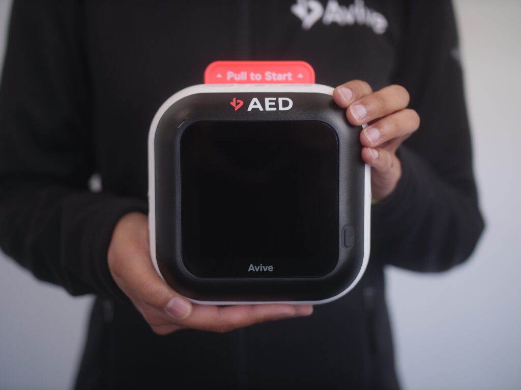 smallest aed being held in hand